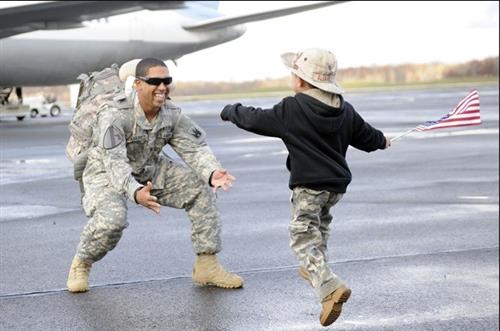 child running to soldier